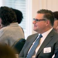 winner sits with family